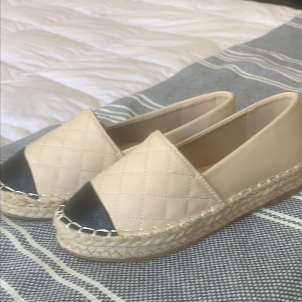 Tan and black cap toe espadrilles